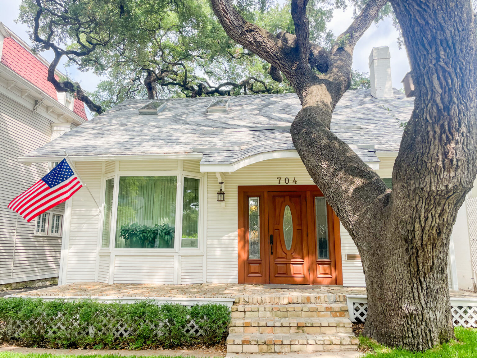 The Paul Parsons law office beneath a live oak at 704 Rio Grande Street in Austin